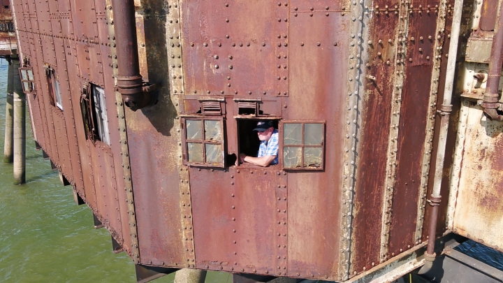 Bob Le-Roi at window of boiler room